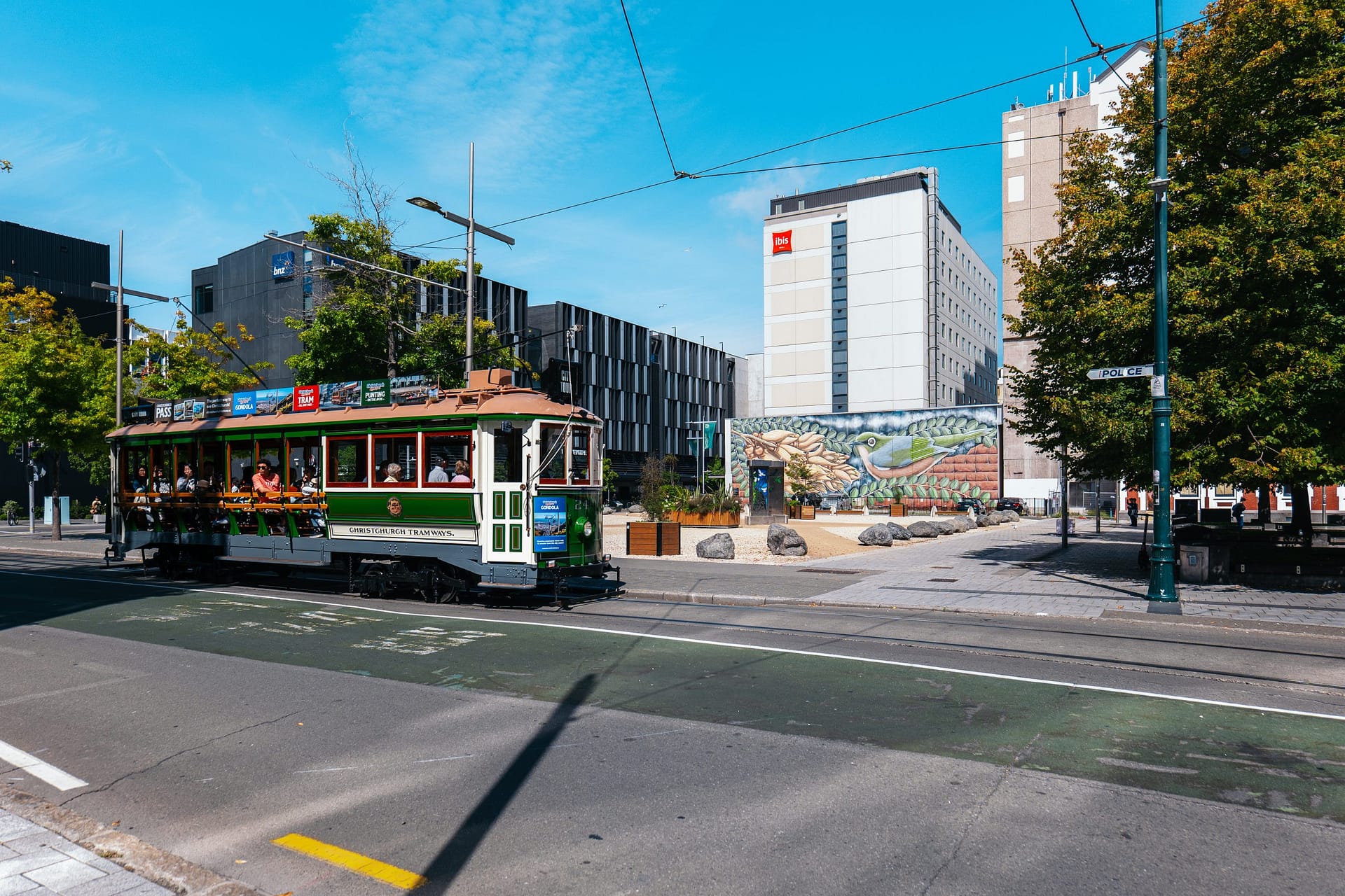 Tram passing by street art